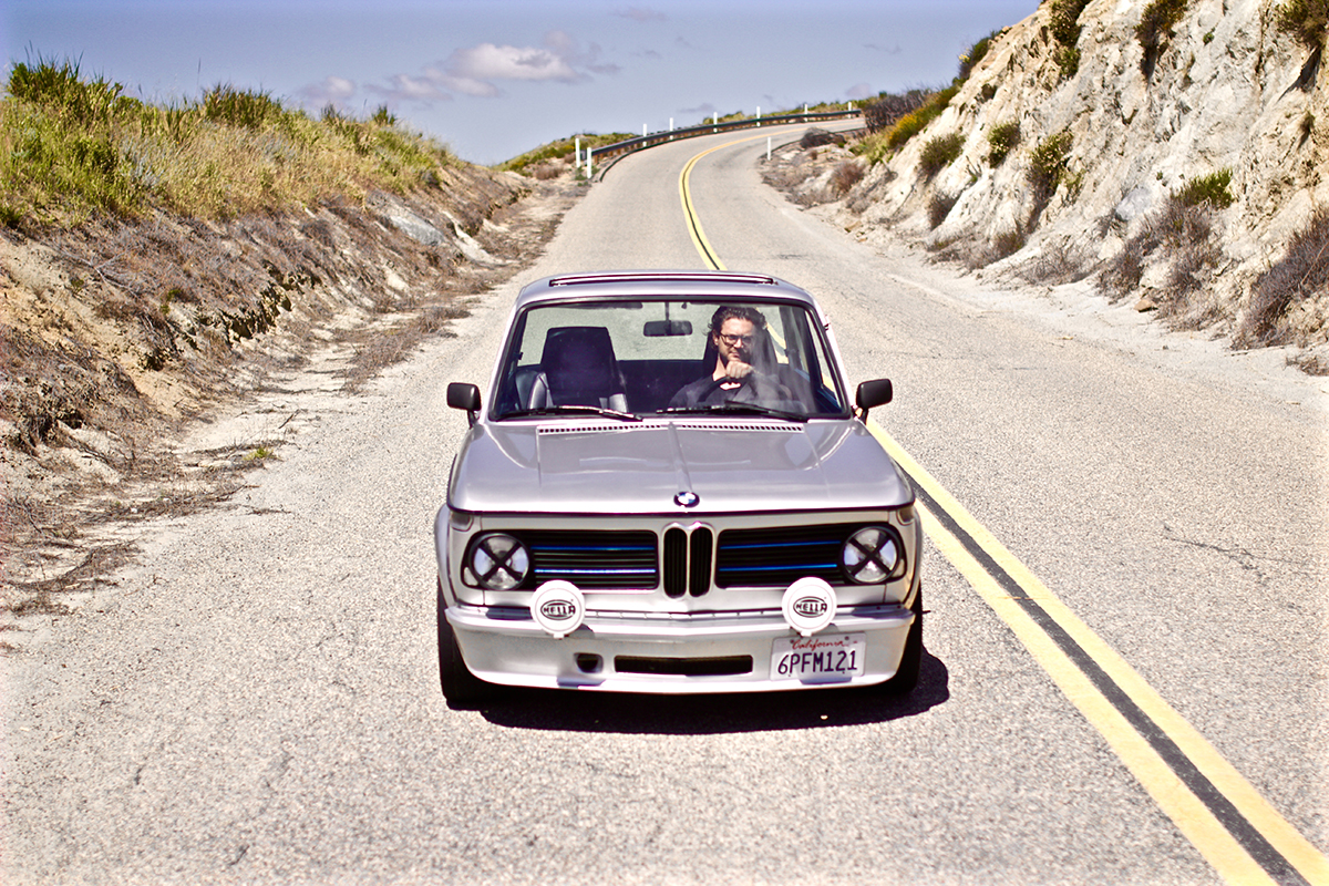 classic car your car Silver 1970 BMW 2002 Front Driving The Dog End of Driving