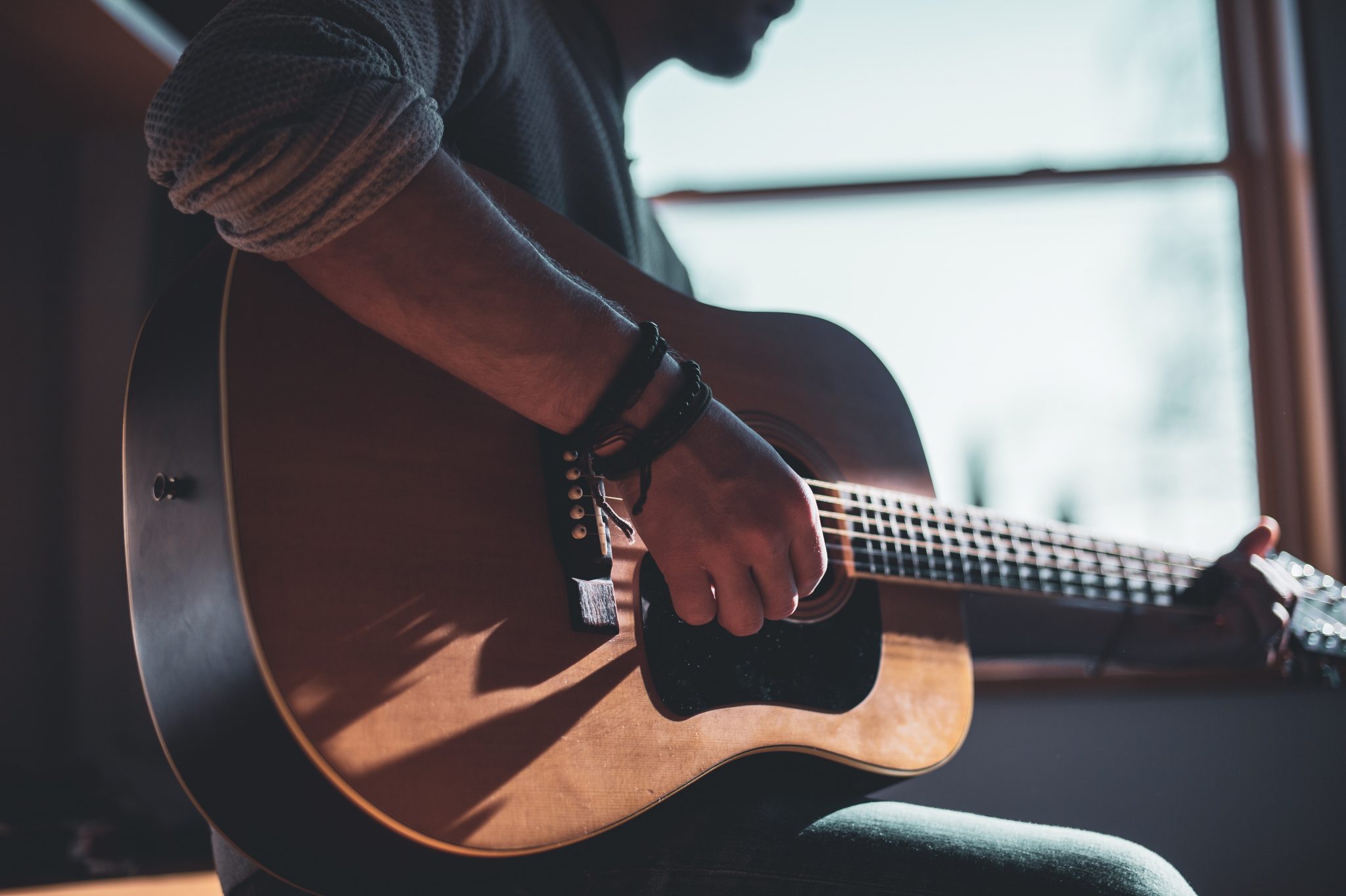 Musical Instruments Musical Instrument Playing Music First Guitar Leather Accessories Home Studio man playing acoustic guitar selective focus photography