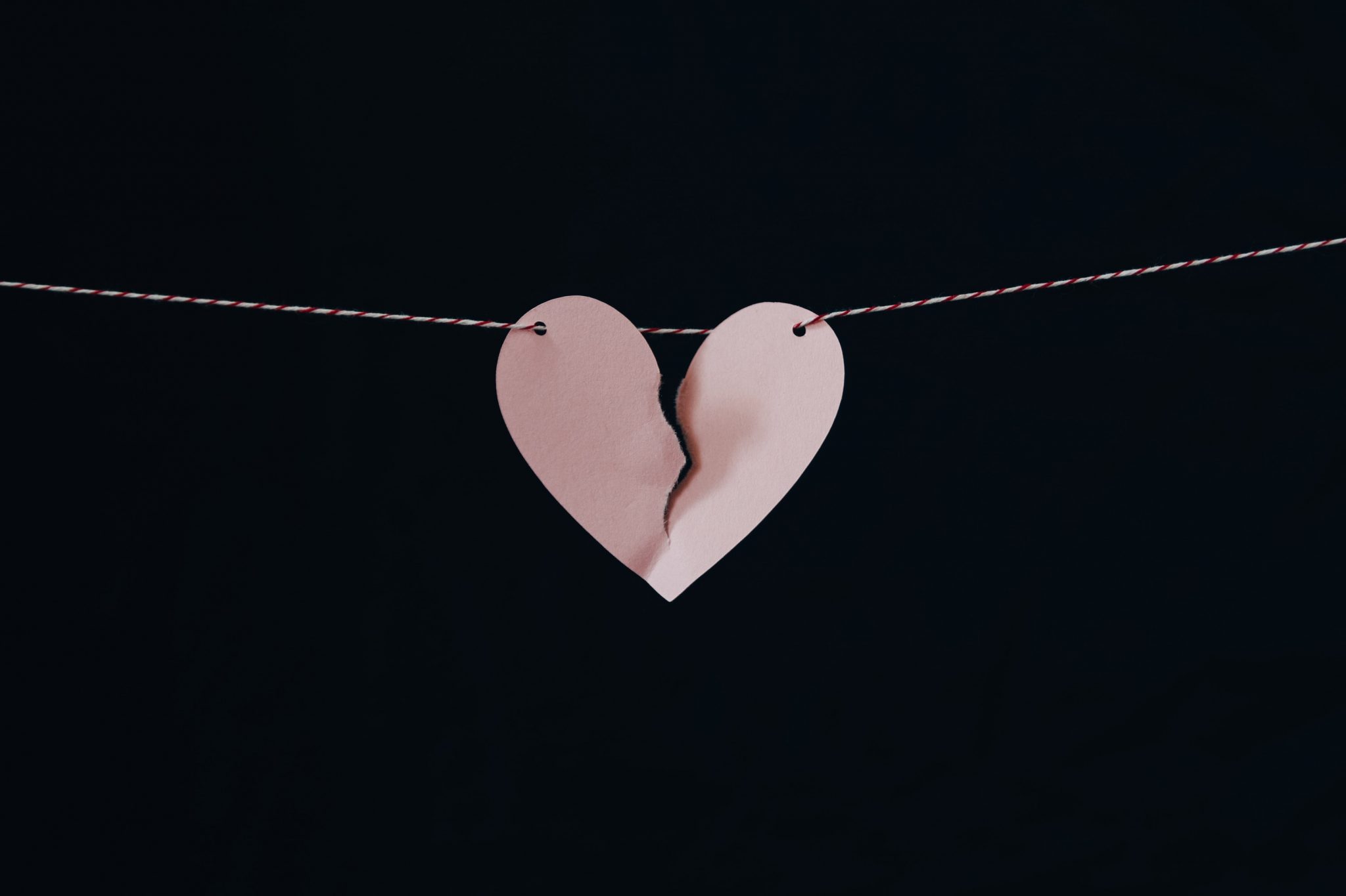 Divorce Attorney broken heart hanging on wire