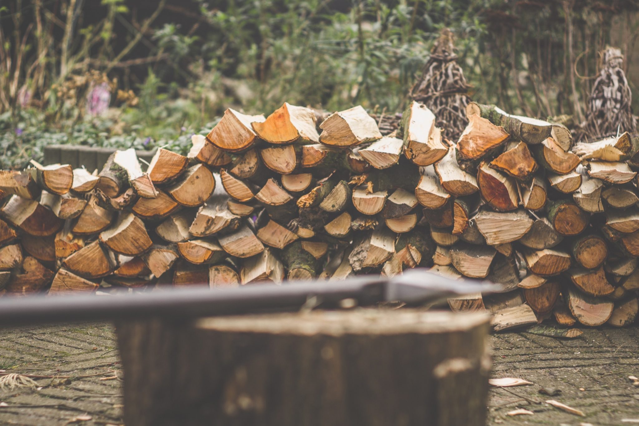 tomahawk brown firewood on brown wooden log