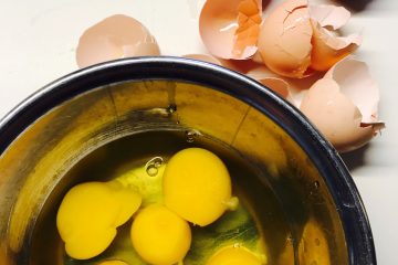 Detox Diet cracked eggs beside round blue bowl
