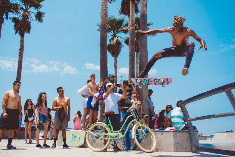 Miami Skateboarding Safety person watching man using skateboard doing tricks during daytime