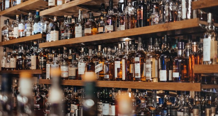 Alcoholism bottle of alcohol Booze Guide assorted-color bottle lot on shelf