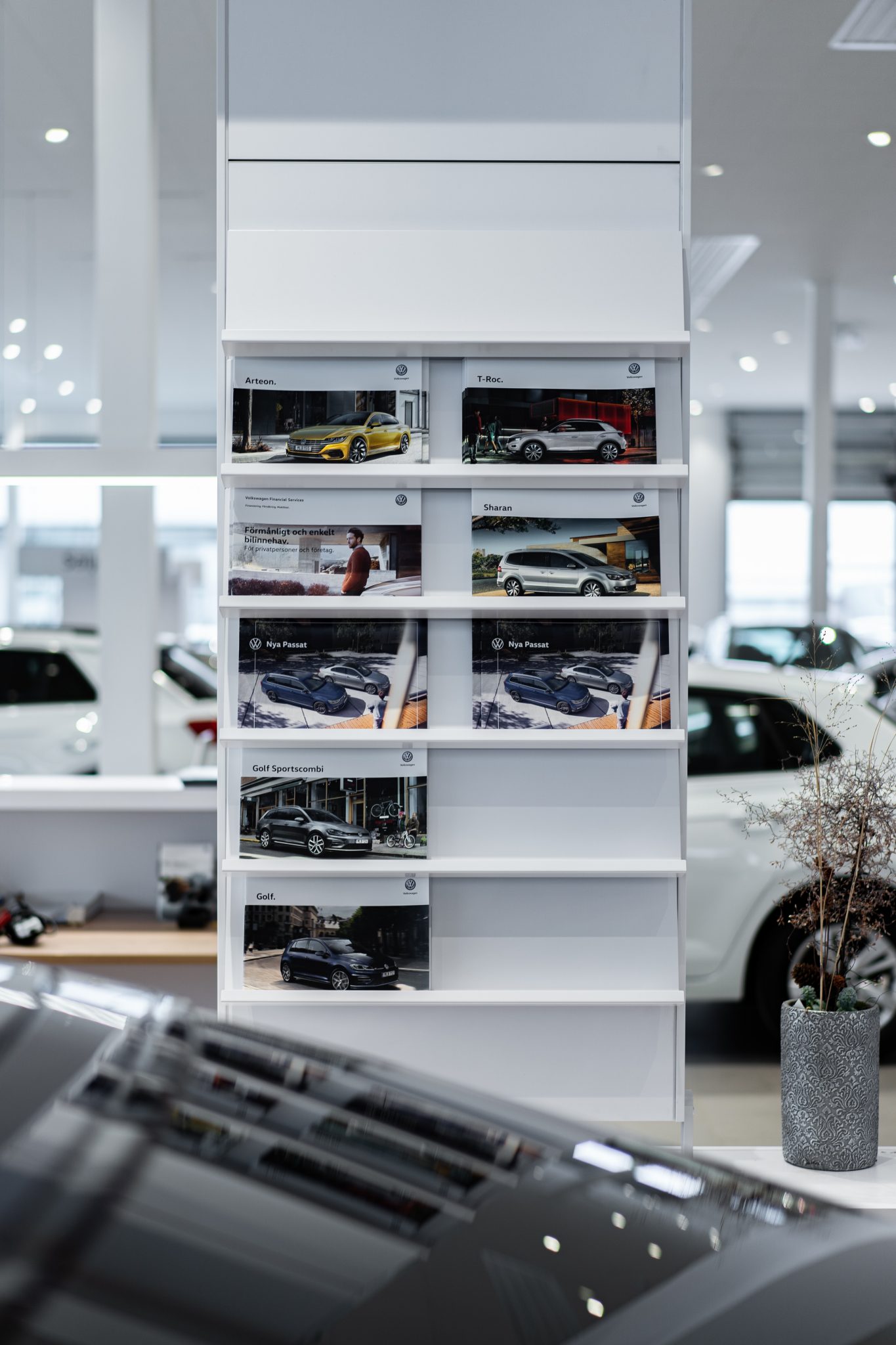 car dealers white wooden shelf with assorted items