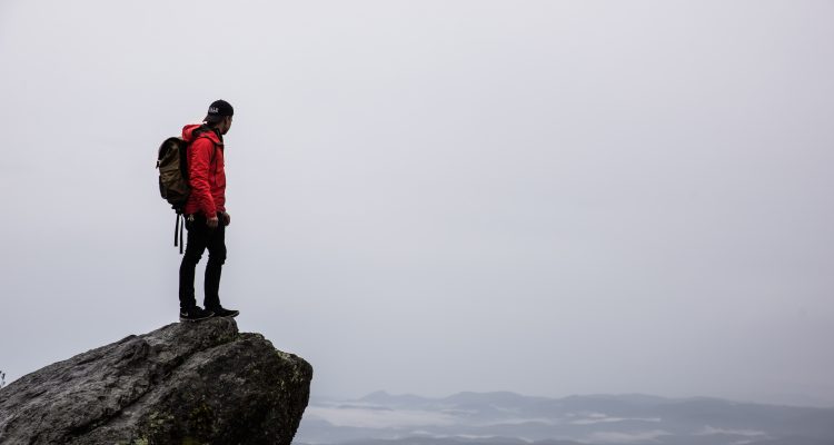 Outdoor Adventures collagen outdoor activities person standing on gray rock
