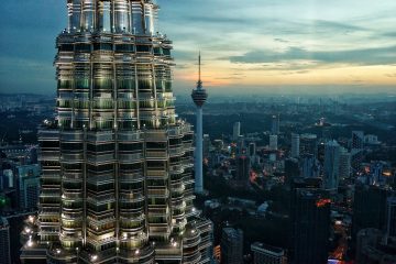 Kuala Lumpur brown high rise buildings under blue sky at daytime