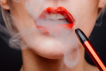 Vaping CBD Vaping E-cigarettes Nicotine-free Tobacco Vaping vs. Smoking CBD brands Vaping woman with red lipstick and red lipstick
