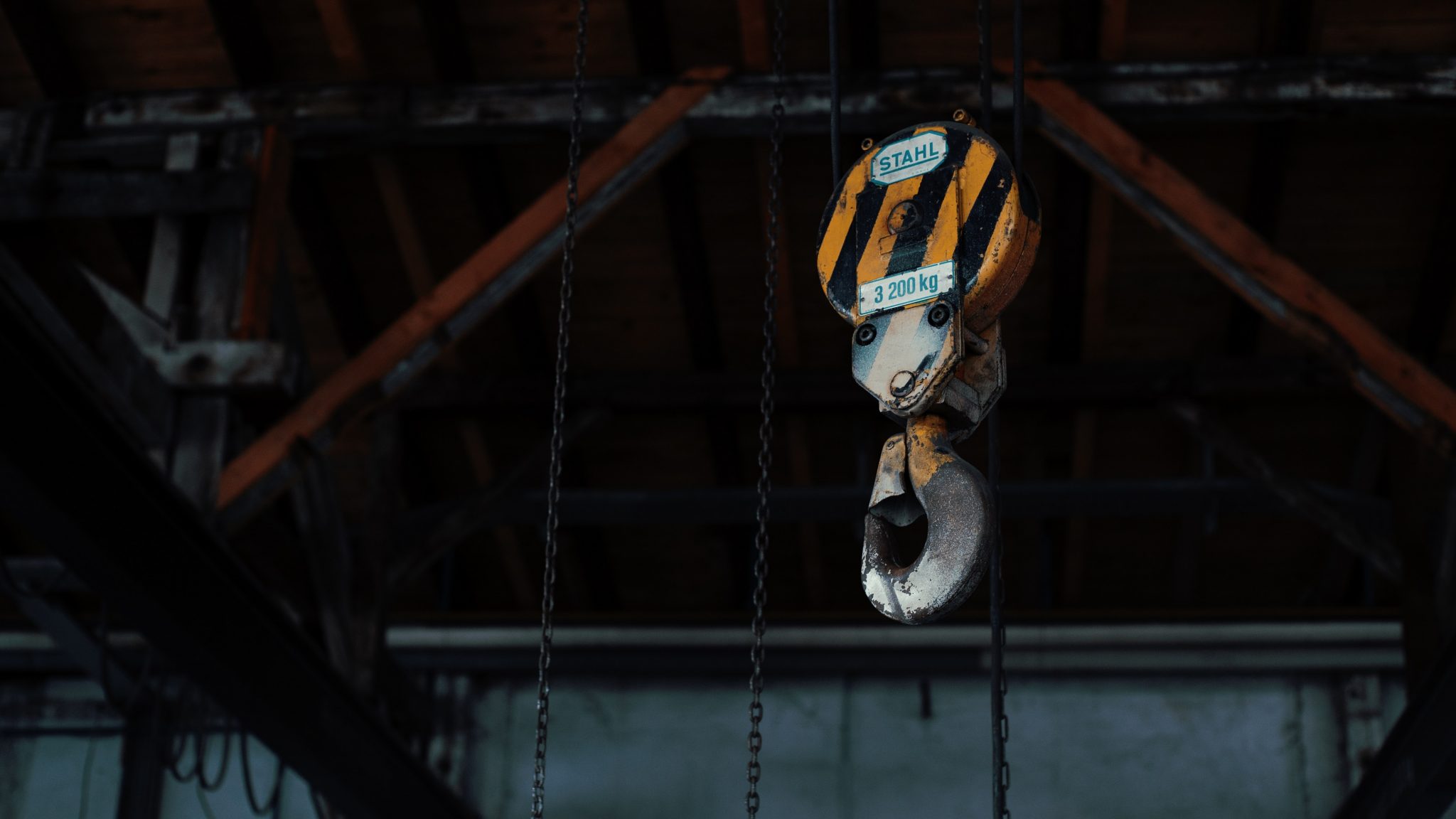 Workers' Compensation Claim Injured At Work Rent a Crane yellow and black chain hoist
