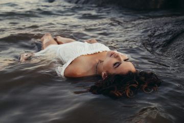 chemise woman relaxing on body of water