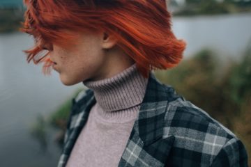 Hairstyles for Red Hair woman in black and white plaid shirt with red hair