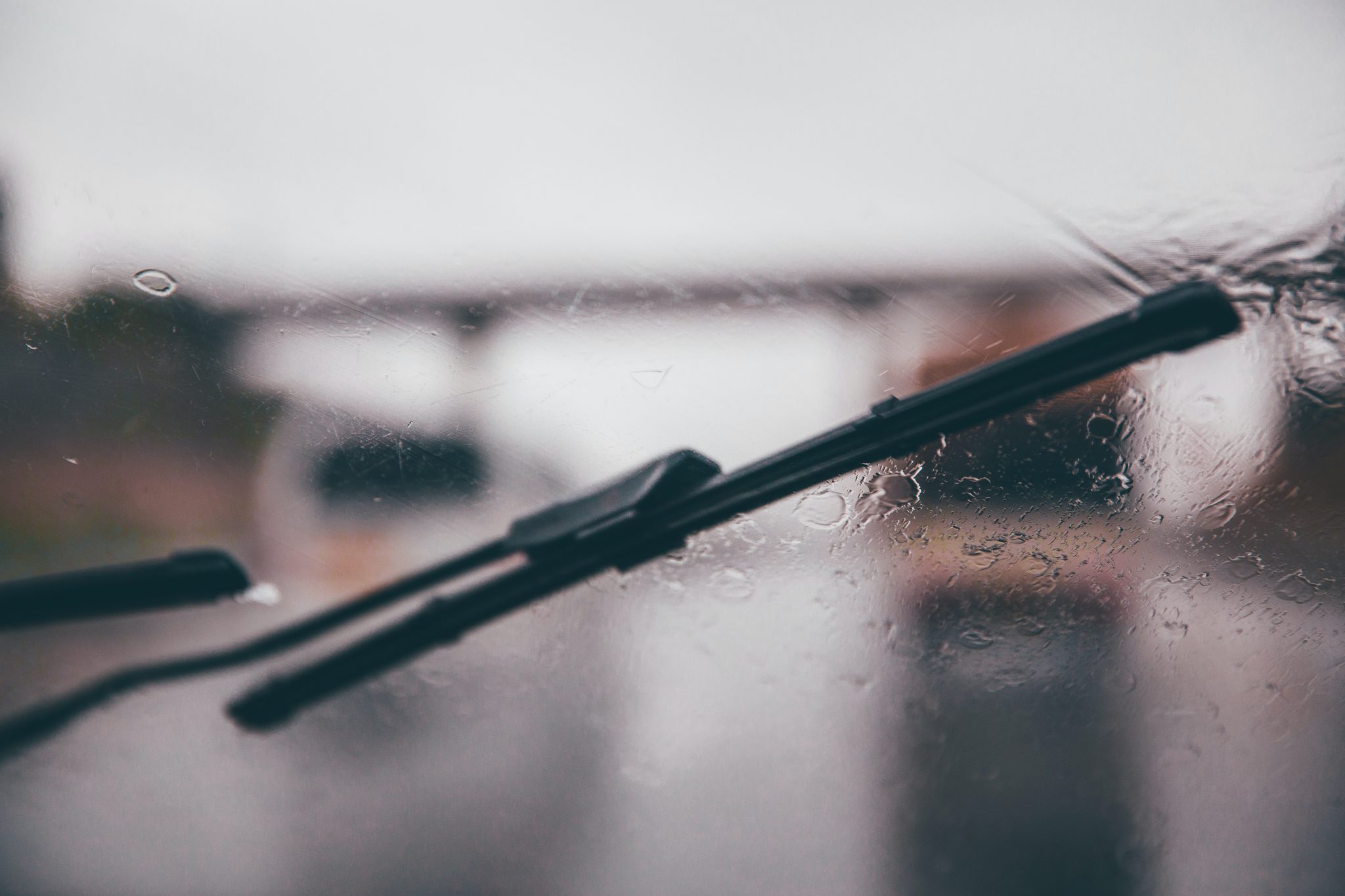 Wiper Blade shallow focus photography of black vehicle wiper