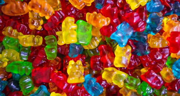 Delta 10 Cravings CBD products CBD Oil Gummies yellow green and red plastic beads