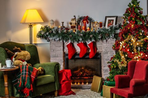 Gifts Event Holiday Season green sofa chair beside green christmas tree