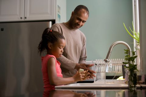 Diabetes Parenting man in long sleeve shirt standing beside girl in pink tank top washing hands