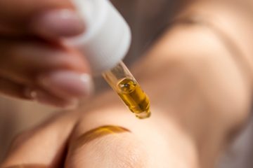 topical cbd Cannabis concentrates Toxins CBD person holding dropper