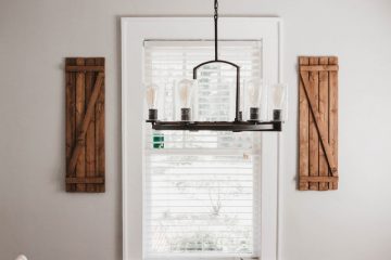 Cabin Design gray and black laptop computer on brown wooden table