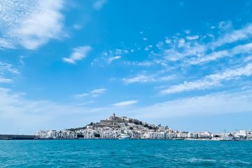 Holiday Mediterranean blue sea under blue sky and white clouds during daytime