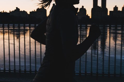 Night Runner silhouette photo of woman running