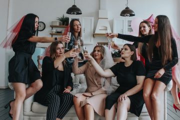 hen night group of women sitting on white floor