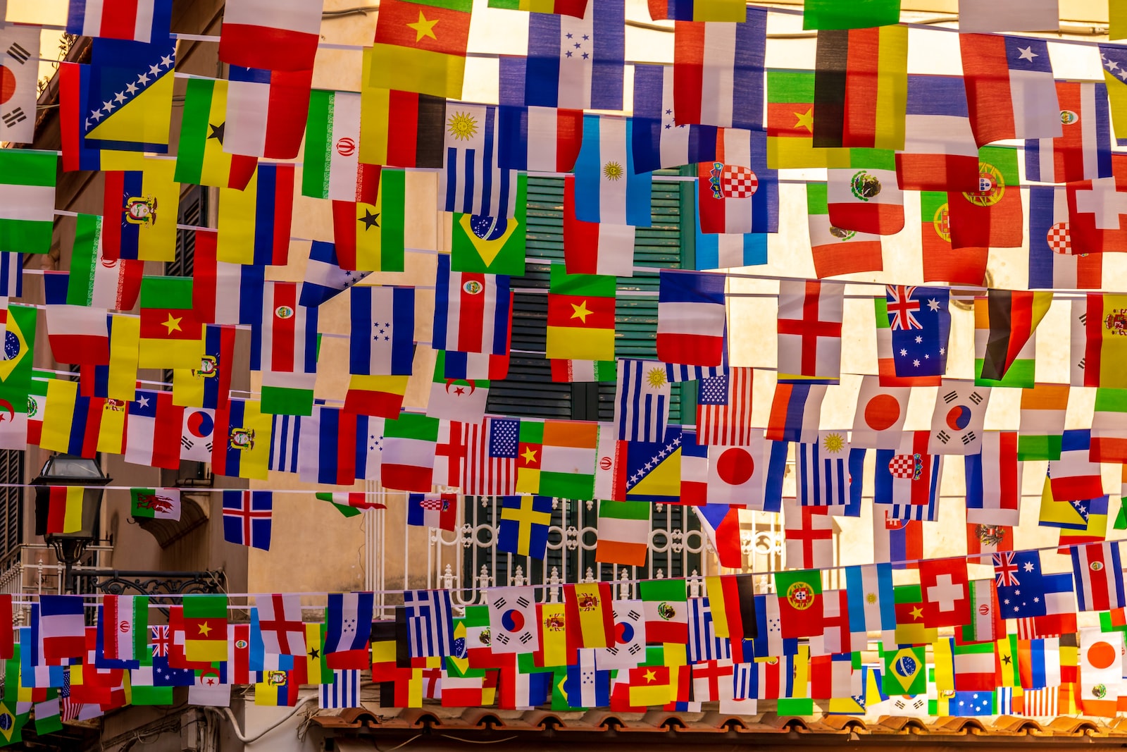 traveling flags multi colored paper on brown cardboard box