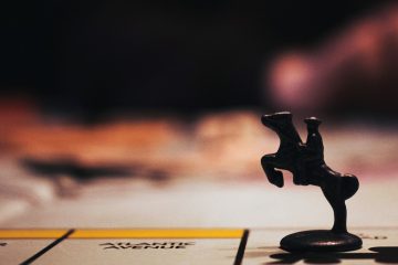 Tabletop gaming night in black wooden figurine on white paper