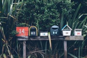 shipping six assorted-color mail boxes