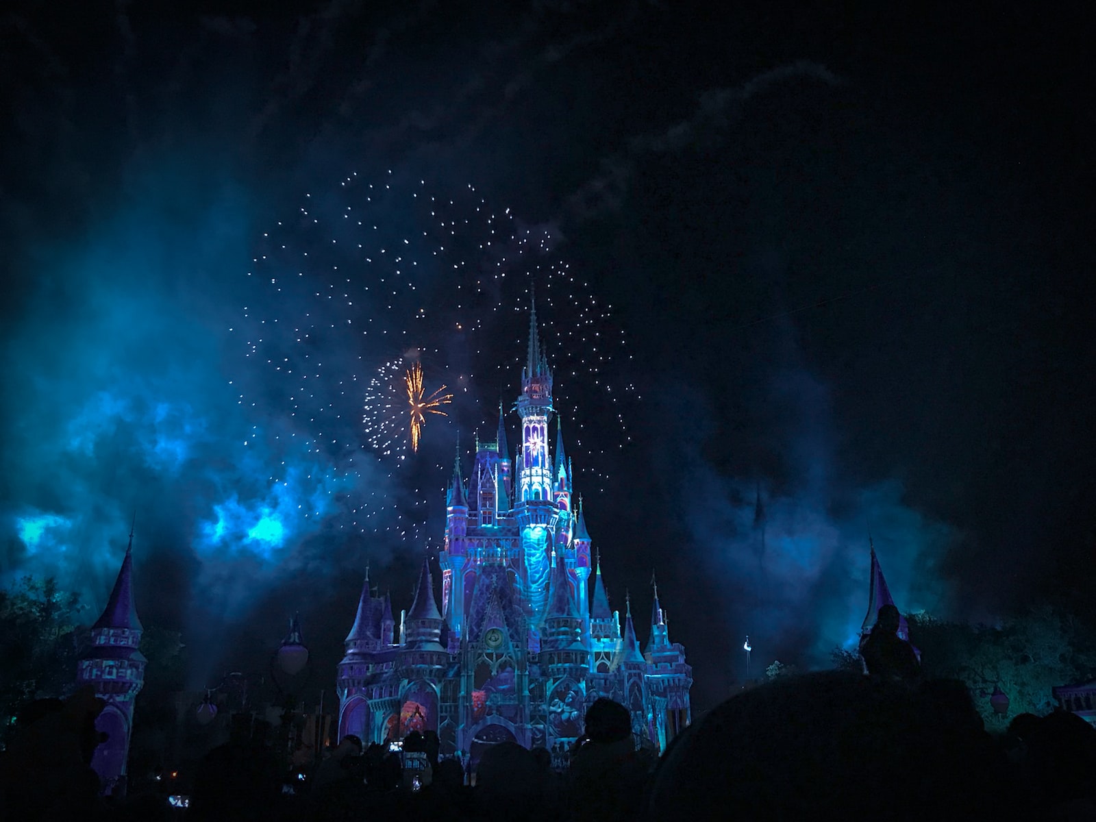 Walt Disney crystal castle with fireworks at night