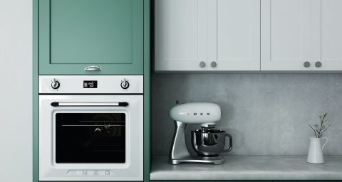 Kitchen Appliances kitchen oven white ceramic mug on white ceramic saucer on white wooden cabinet