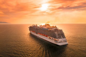 cruise white ship on sea during sunset