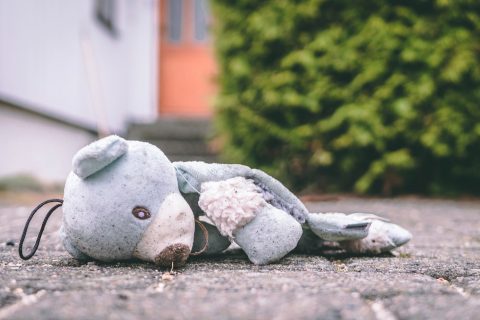 personal injury lawyer Child Victims photo of bear plush toy on pavement