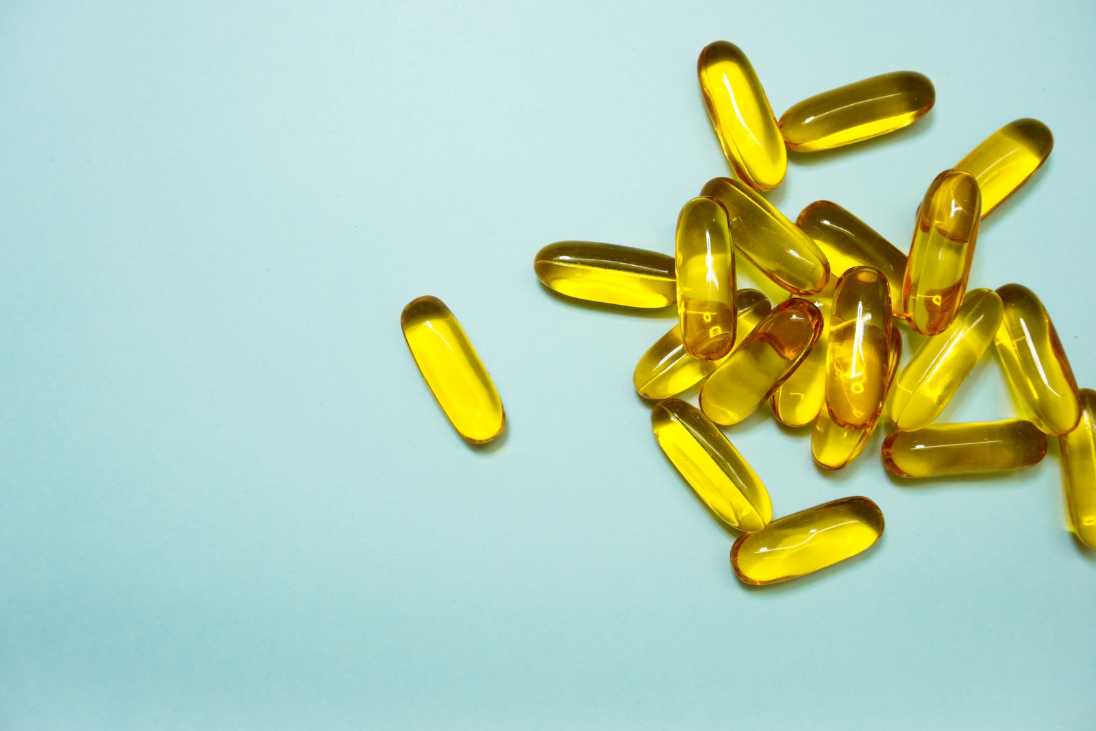 Sleeping pills Kratom capsules brown and yellow medication tablets