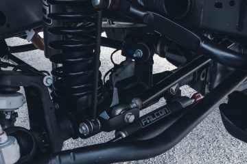 spring a close up of the front suspension of a motorcycle