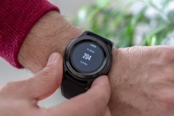 gadgets person wearing round black smartwatch