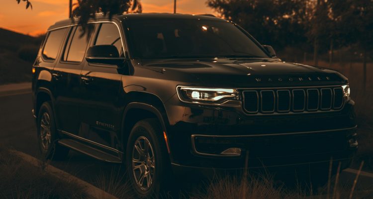 Truckers Jeep Wagoneer a black car parked on a road