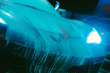 Car detailing a blue and white corvette car wash