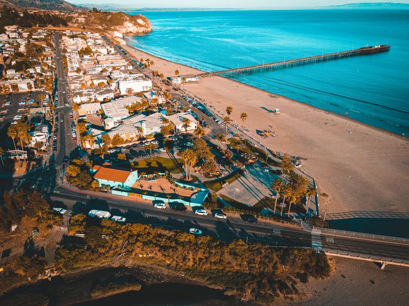 Aerial view of California coast beach and pier in summer