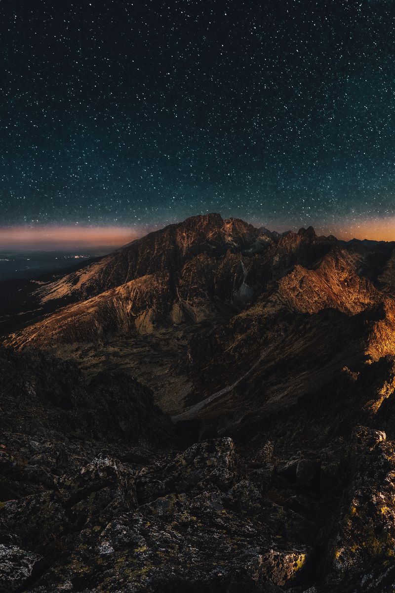 High-altitude mountain peaks and valleys in Kyrgyzstan's Tien Shan range