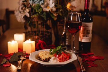 Candlelit dinner table set for two, romantic date night ambiance