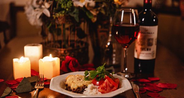 Candlelit dinner table set for two, romantic date night ambiance