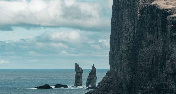 Dramatic cliffs meeting the ocean in the Faroe Islands