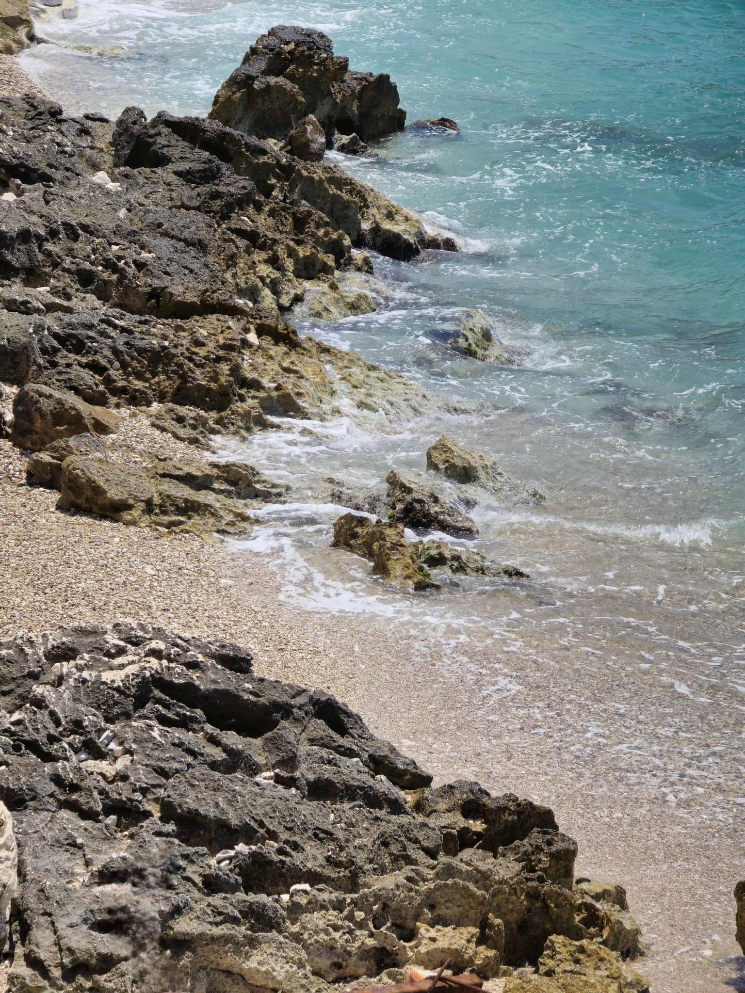 Rocky coastline and turquoise water along the Albanian Riviera in Sarande