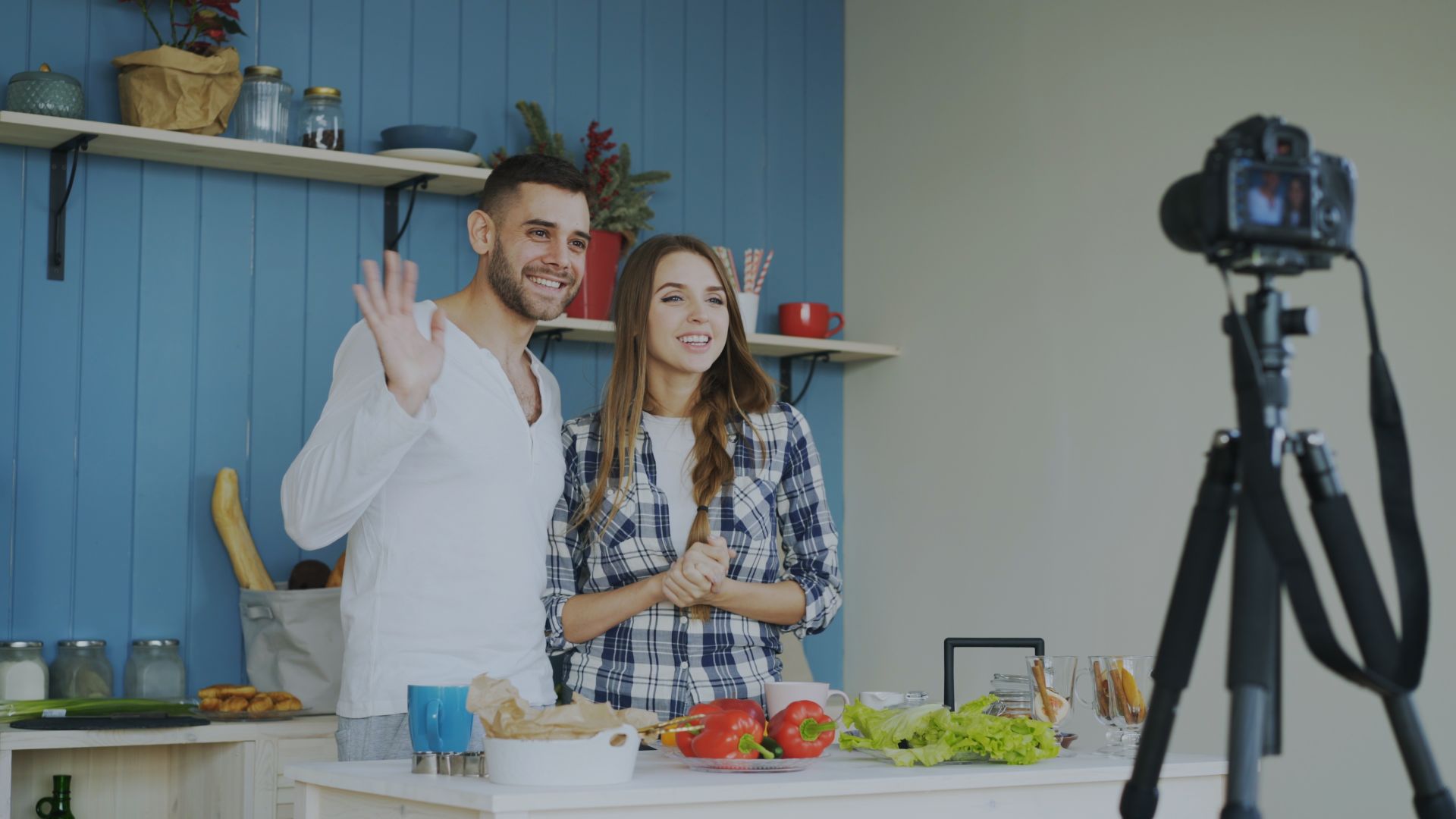 Content creators filming a cooking video in a modern kitchen
