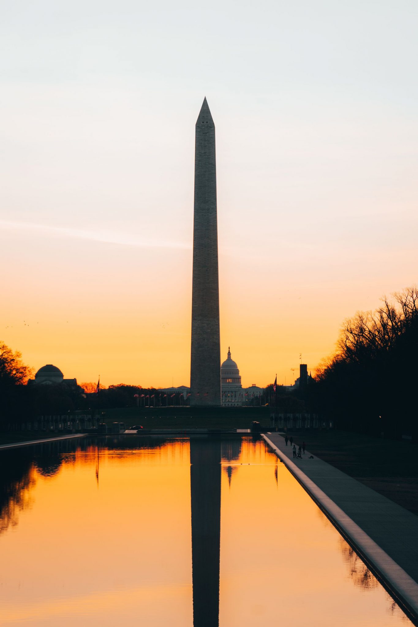 The Washington Monument reflecting in the pool at sunset